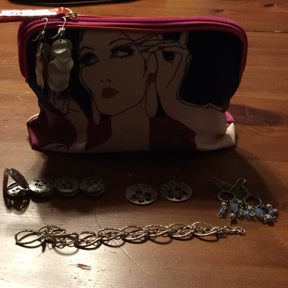 Bundle of jewelry with an Estée Lauder Makeup bag.